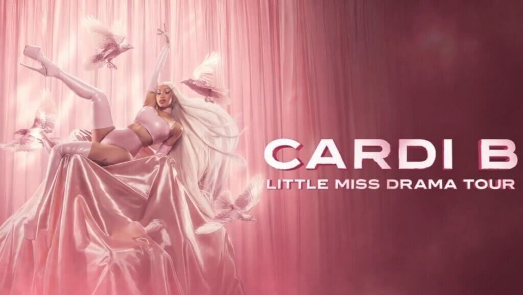 Cardi B dalam pakaian pink dengan rambut putih panjang dan merpati untuk gambar promosi Little Miss Drama Tour