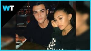 Noah Centineo and Madelyn Cline sitting together at a table with sushi and soy sauce.