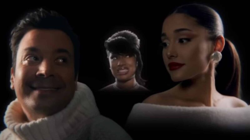 Jimmy Fallon and Ariana Grande smiling with a hologram of Aretha Franklin between them