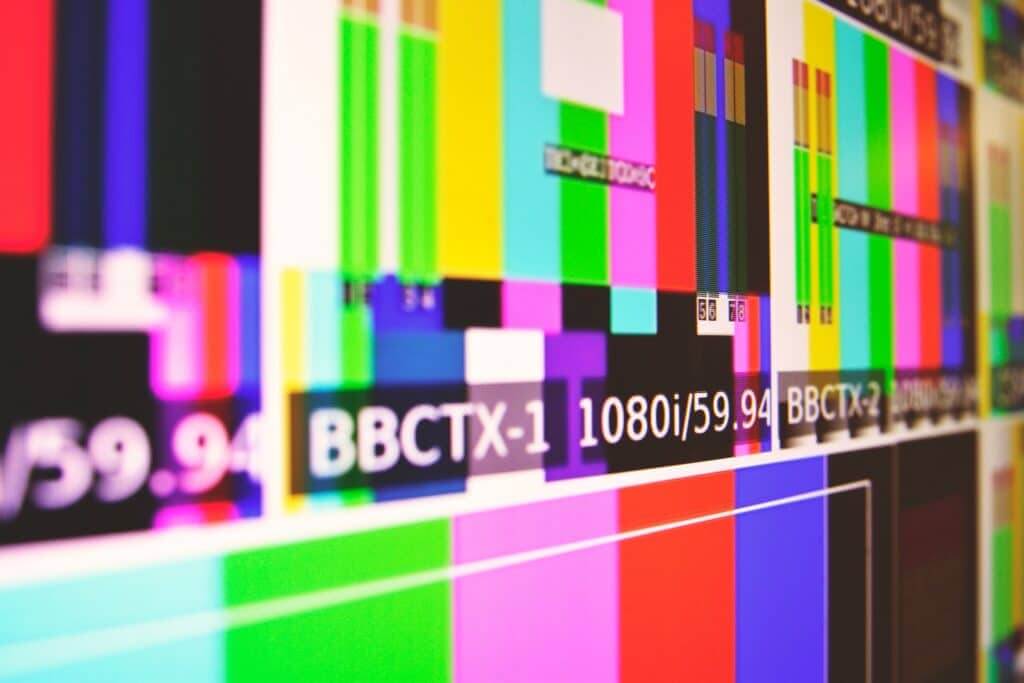 Colorful TV test pattern screen with labels BBCTX-1 and 1080i/59.94 resolution details