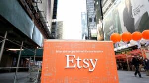 Etsy marketplace promotional booth with orange balloons in an urban outdoor setting