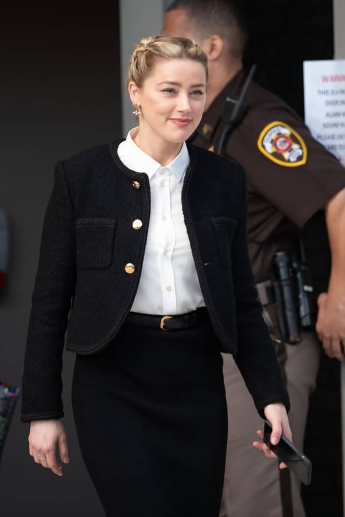 Amber Heard departs outside court during the Johnny Depp and Amber Heard civil trial at Fairfax County Circuit Court on May 19, 2022 in Fairfax, Virginia. Depp is seeking $50 million in alleged damages to his career over an op-ed Heard wrote in the Washington Post in 2018.