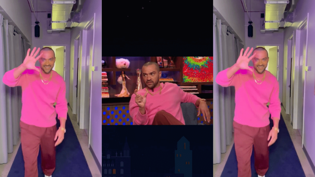 Jesse Williams in a pink sweater and brown pants waving in a hallway and seated during a talk show interview.