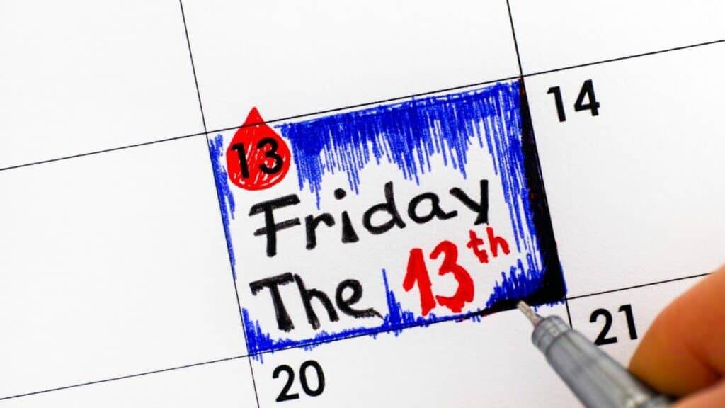 Calendar date marked with a red drop and blue shading highlighting Friday the 13th.