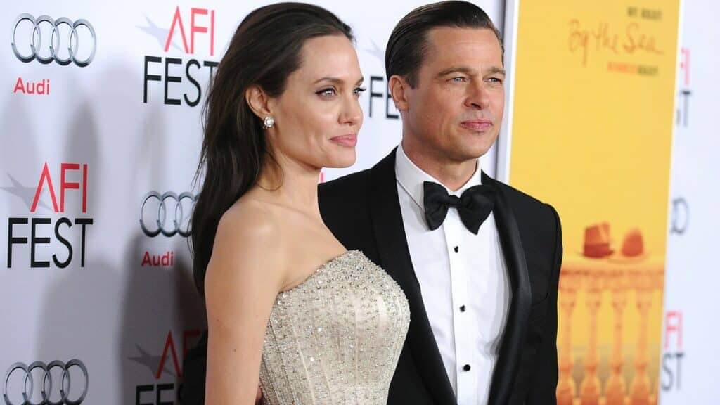 Angelina Jolie in a beaded strapless gown and Brad Pitt in a black tuxedo at AFI Fest red carpet event
