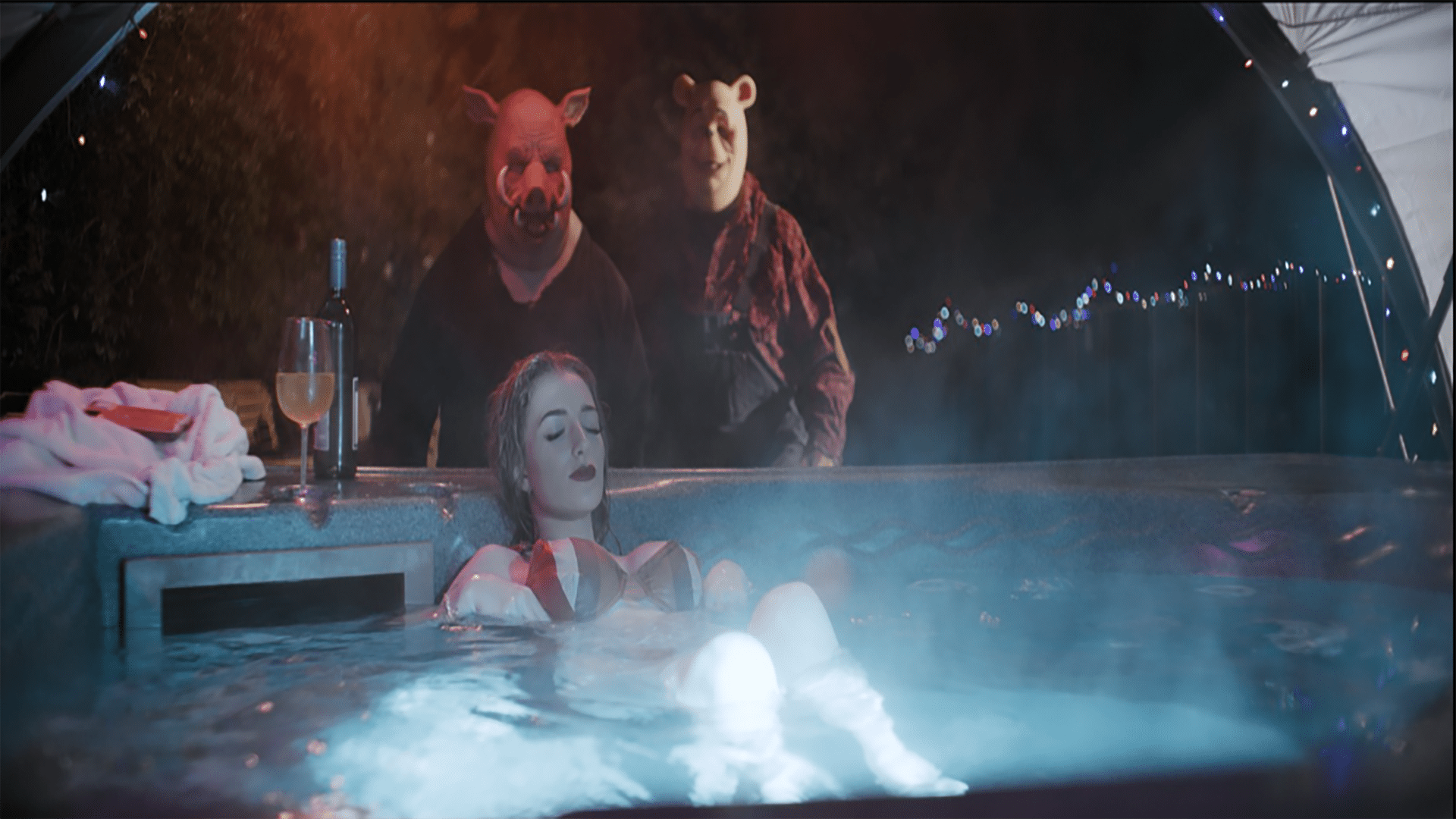woman in hotub with eyes closed. behind her to beings, one with a winnie the pooh mask and one with a piglet mask are lurking over her