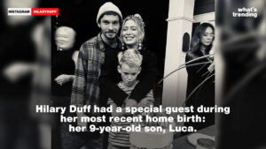 Hilary Duff with her 9-year-old son Luca and a man, celebrating with a cake indoors.