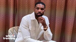 Man in white textured shirt sitting on patterned chair with chevron curtain background and "what's trending" text.