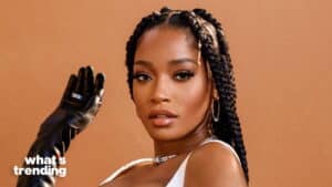 Woman with braided hair wearing a white top and black leather glove against a brown background with "what's trending" text