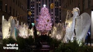 Rockefeller Center Christmas tree with illuminated angel decorations at night in New York City