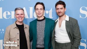 Jim Parsons, Matt Bomer, and Zachary Quinto posing together at a press event with a blue backdrop.