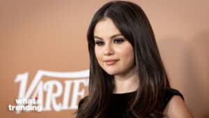 Selena Gomez with long dark hair and black dress at a Variety event with "what's trending" logo