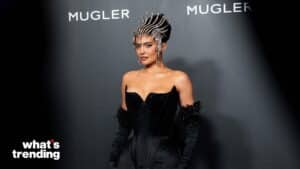Kylie Jenner wearing a black corset dress and jeweled headpiece at a Mugler event