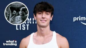 Young man in white tank top smiling at a Prime Video event with an inset ultrasound image of a fetus.