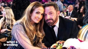 Jennifer Lopez and Ben Affleck posing together at a formal event with a "what's trending" logo visible