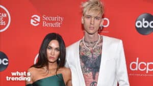 Megan Fox and Machine Gun Kelly posing on the red carpet at the American Music Awards.