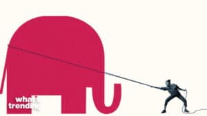 Person pulling a large red elephant silhouette with a rope next to "what's trending" text.