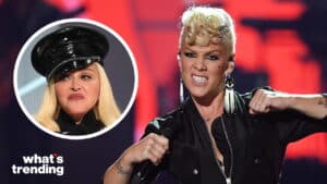 Pink performing on stage with a microphone, inset of Madonna wearing a black hat.