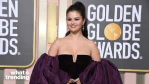 Selena Gomez wearing a strapless black and purple gown at the Golden Globe Awards.