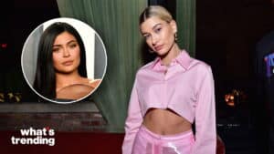 Hailey Bieber in a pink cropped shirt and pants with an inset photo of Kylie Jenner and "what's trending" text.