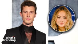 Shawn Mendes in a black suit with a circular inset of Sabrina Carpenter smiling against a blue background