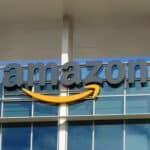 Close-up of sign with logo on facade of the regional headquarters of ecommerce company Amazon in the Silicon Valley town of Sunnyvale, California, October 28, 2018.