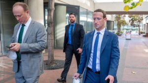 Mark Zuckerberg, chief executive officer of Meta Platforms Inc., right, departs from federal court in San Jose, California, US, on Tuesday, Dec. 20, 2022.