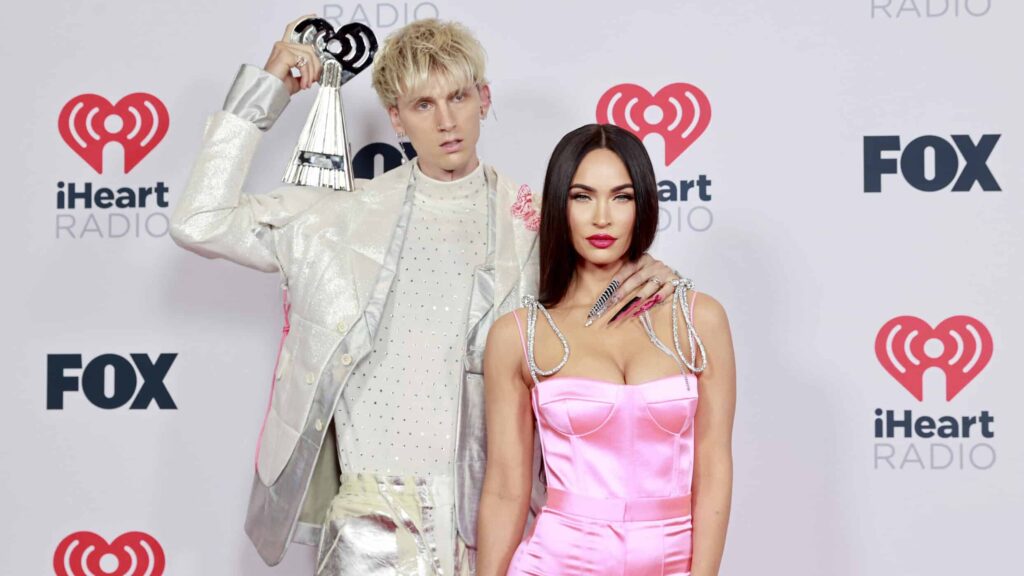 Machine Gun Kelly, winner of the Alternative Rock Album of the Year award for 'Tickets To My Downfall,’ and Megan Fox attend the 2021 iHeartRadio Music Awards at The Dolby Theatre in Los Angeles, California, which was broadcast live on FOX on May 27, 2021.