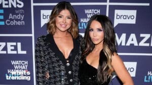 Two women posing at a Bravo event with "Watch What Happens Live" backdrop