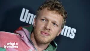 Jack Quaid wearing a multicolored hoodie at a What’s Trending event