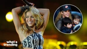 Shakira smiling and performing on stage with an inset of her wearing a Detroit Red Wings cap holding two children.