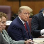Former U.S. President Donald Trump sits at the defense table with his defense team in a Manhattan court during his arraignment on April 4, 2023, in New York City. Trump was arraigned during his first court appearance today following an indictment by a grand jury that heard evidence about money paid to adult film star Stormy Daniels before the 2016 presidential election. With the indictment, Trump becomes the first former U.S. president in history to be charged with a criminal offense.