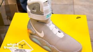 Nike Mag self-lacing sneaker displayed on a yellow platform with "Magnetic Anti Gravity" label.