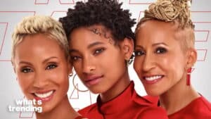 Jada Pinkett Smith, Willow Smith, and Adrienne Banfield-Norris smiling together in red outfits