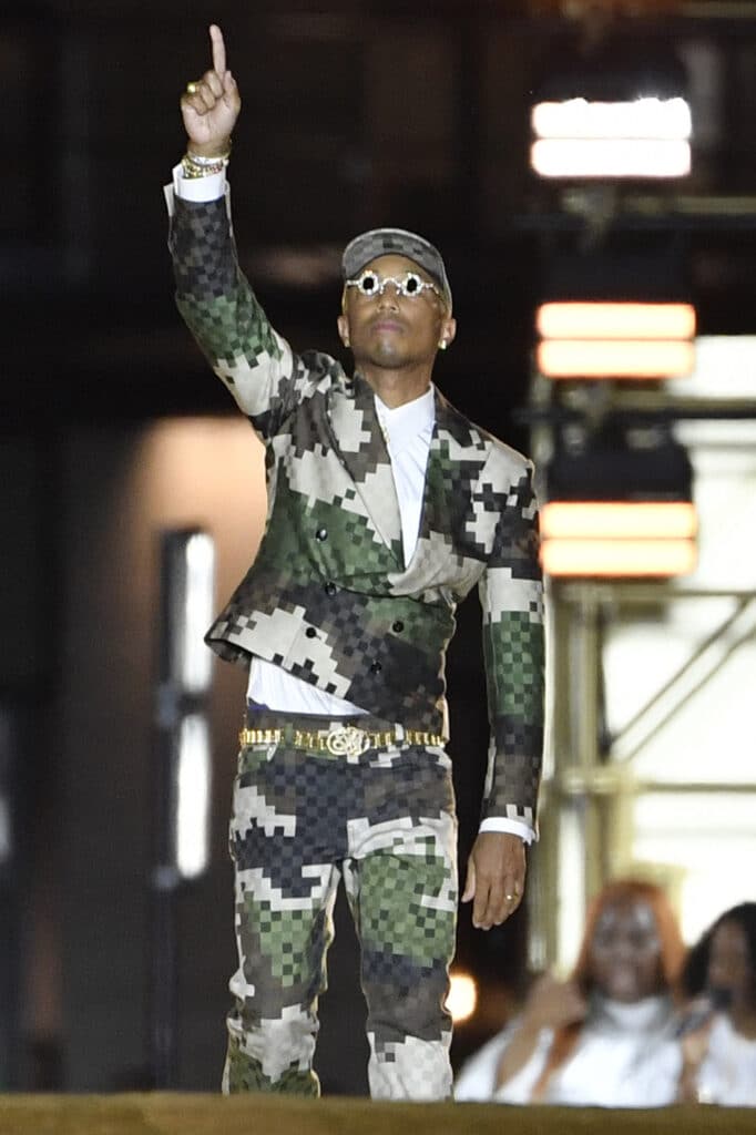 US Louis Vuitton' fashion designer and singer Pharrell Williams acknowledges the audience at the end of the Louis Vuitton Menswear Spring-Summer 2024 show as part of the Paris Fashion Week on the Pont Neuf, central Paris, on June 20, 2023.