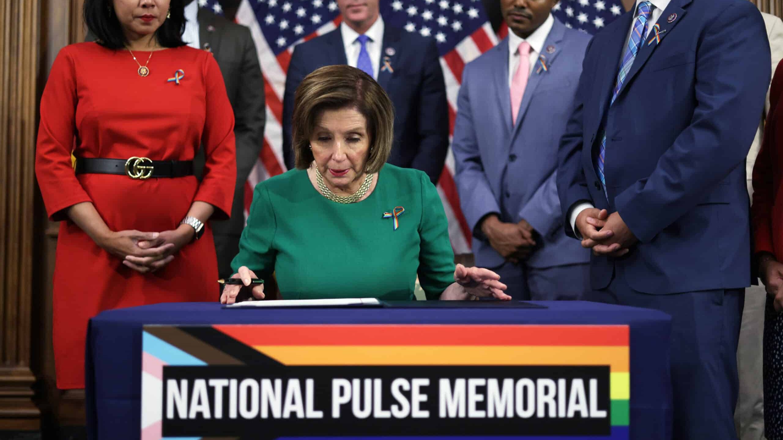 WASHINGTON, DC - JUNE 16: U.S. Speaker of the House Rep. Nancy Pelosi (D-CA) (C) participates in a bill enrollment ceremony to designate the National Pulse Memorial in Orlando, Florida, as other House Democrats look on at the U.S. Capitol June 16, 2021 in Washington, DC. The Congress has passed a legislation to designate the site of Pulse, a former LGBTQ+ nightclub, as a national memorial to honor the victims of the mass shooting on June 12, 2016 that killed 49 lives and injured dozens more.