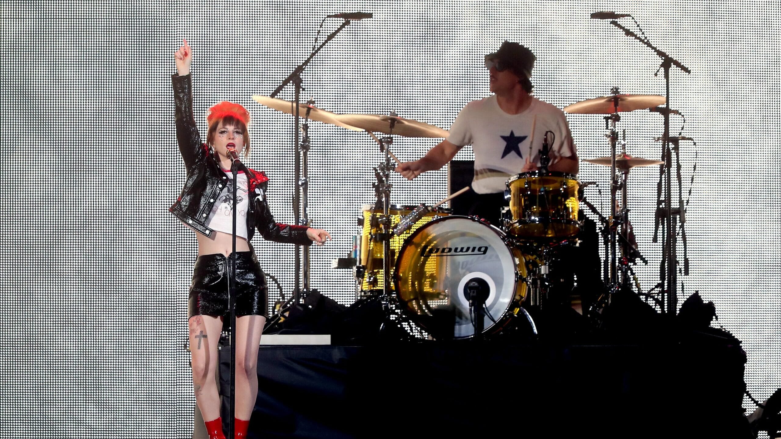GLENDALE, ARIZONA - MARCH 17: Editorial use only and no commercial use at any time. No use on publication covers is permitted after August 9, 2023. (L-R) Hayley Williams and Zac Farro of Paramore perform onstage for the opening night of "Taylor Swift | The Eras Tour" at State Farm Stadium on March 17, 2023 in Glendale, Arizona. The city of Glendale, Arizona was ceremonially renamed to Swift City for March 17-18 in honor of The Eras Tour.