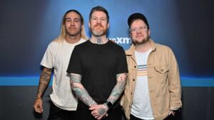 NEW YORK, NEW YORK - MARCH 23: (EXCLUSIVE COVERAGE) (L-R) Pete Wentz, Andy Hurley and Patrick Stump of rock band Fall Out Boy visit The Morning Mash Up at SiriusXM Studios on March 23, 2023 in New York City.