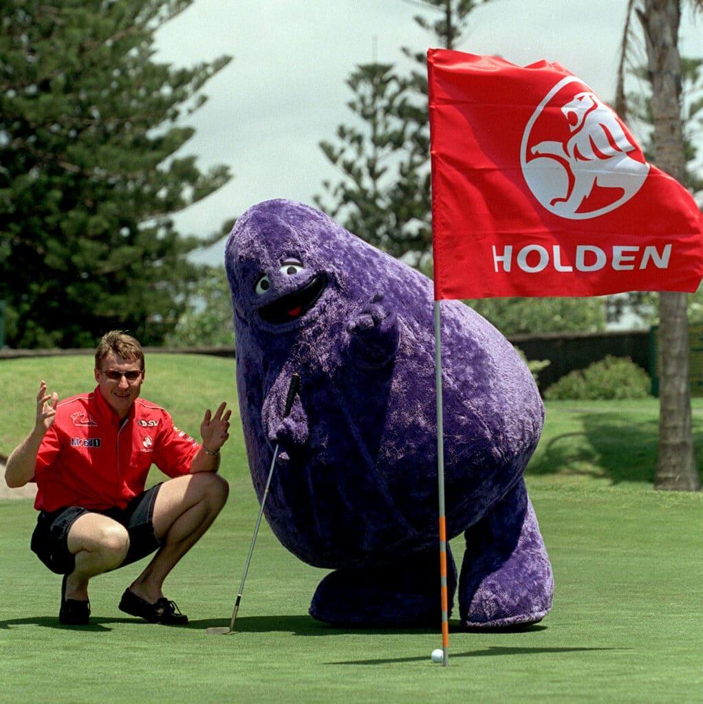 15 Dec 2000: Race car driver Mark Skaife of Australia and Grimace of McDonalds at the launch of Skaife's Invitational Charity Golf Day at the Tuggerah Lakes Golf Course, Tuggerah, Australia.