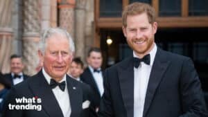 Prince Charles and Prince Harry smiling in black tuxedos at a formal event