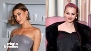 Hailey Bieber in a silver strapless dress and Selena Gomez in a black outfit with a long braid at an event