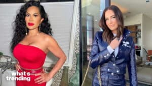 Two women posing, one in a red strapless dress and the other in a blue leather jacket with a chain strap bag.