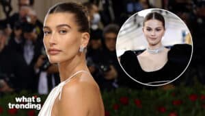 Hailey Bieber in a white dress and Selena Gomez in a black dress with diamond necklace at a red carpet event