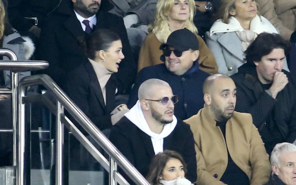 Leonardo DiCaprio and his girlfriend Camila Morrone, below DJ Snake attend the UEFA Champions League Group C match between Paris Saint-Germain (PSG) and Liverpool FC at Parc des Princes stadium on November 28, 2018 in Paris, France. 