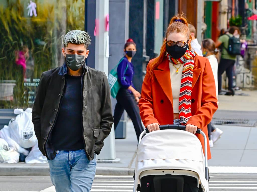 Zayn Malik and Gigi Hadid take baby Khai on a walk to lunch at The Smil on March 25, 2021 in New York City.