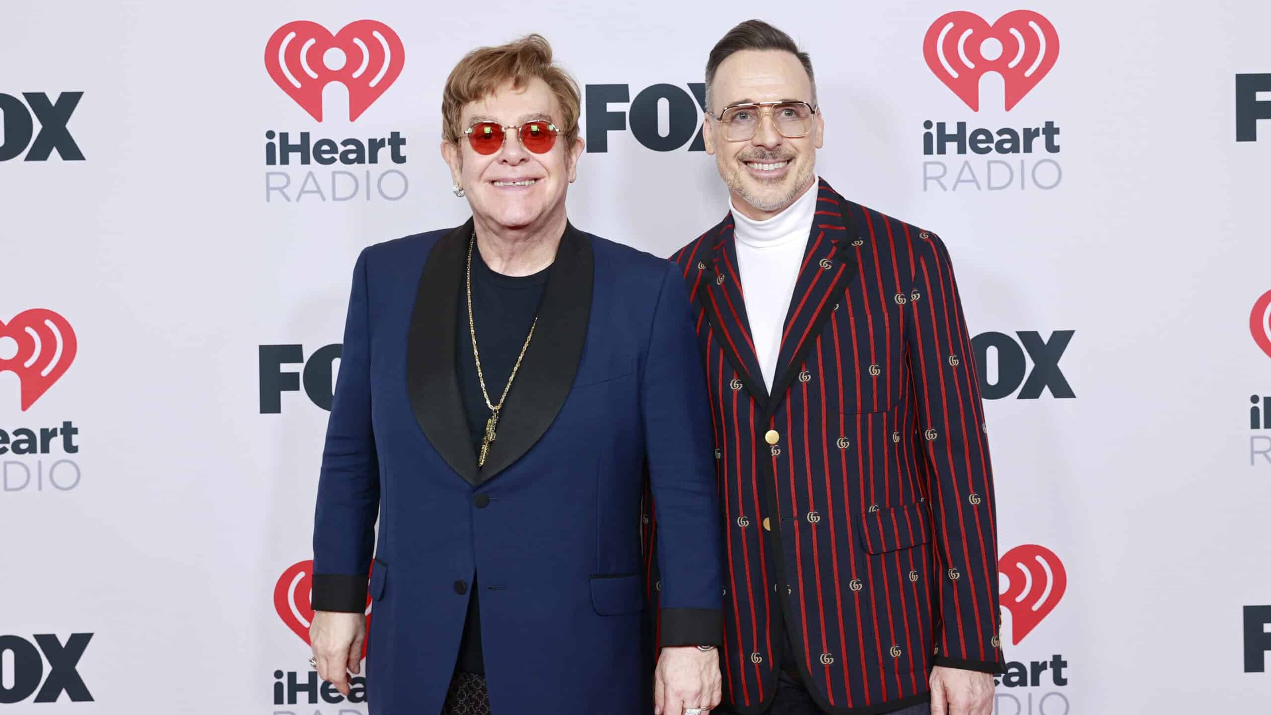 Honoree Elton John and David Furnish attend the 2021 iHeartRadio Music Awards at The Dolby Theatre in Los Angeles, California, which was broadcast live on FOX on May 27, 2021.