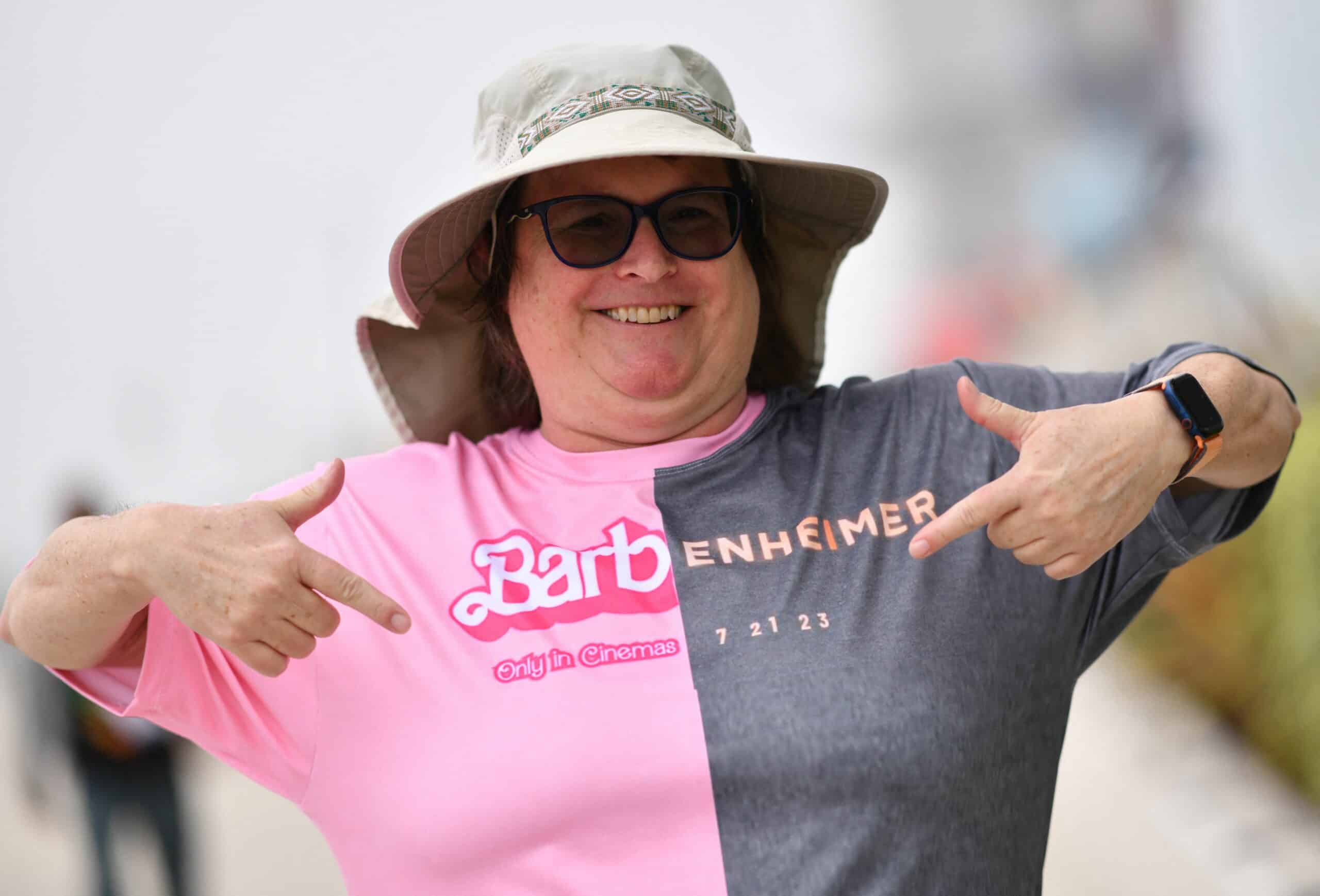 An attendee points at her Barbenheimer shirt outside the convention center during San Diego Comic-Con International in San Diego, California, on July 20, 2023.