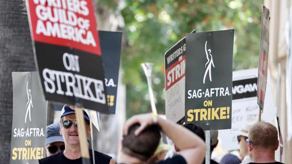 BURBANK, CALIFORNIA - JULY 17: Striking SAG-AFTRA members picket with striking WGA (Writers Guild of America) workers outside Warner Bros. Studio on July 17, 2023 in Burbank, California. Members of SAG-AFTRA, Hollywood’s largest union which represents actors and other media professionals, have joined the striking writers in the first joint walkout against the studios since 1960. The strike could shut down Hollywood productions completely with writers in the third month of their strike against the Hollywood studios.
