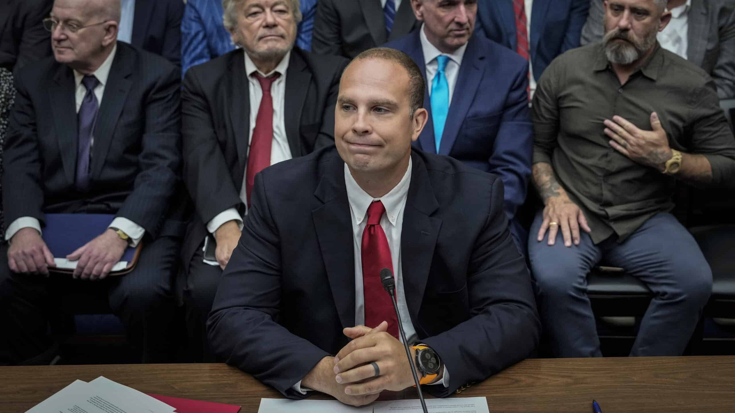 WASHINGTON, DC - JULY 26: David Grusch, former National Reconnaissance Officer Representative of Unidentified Anomalous Phenomena Task Force at the U.S. Department of Defense, takes his seat as he arrives for a House Oversight Committee hearing titled "Unidentified Anomalous Phenomena: Implications on National Security, Public Safety, and Government Transparency" on Capitol Hill 26, 2023 in Washington, DC. Several witnesses are testifying about their experience with possible UFO encounters and discussion about a potential covert government program concerning debris from crashed, non-human origin spacecraft.