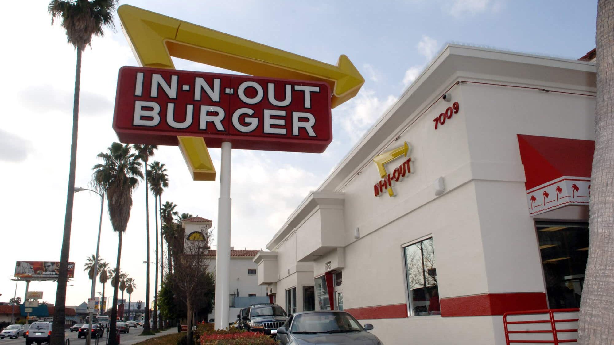 UNITED STATES - JANUARY 25: Drivers line up to pick up their orders from the drive through window at the In-N-Out Burger on Sunset Boulevard in the Hollywood area of Los Angeles, California, Wednesday, Jan. 25, 2006. Since Harry and Esther Snyder opened their first drive-through hamburger restaurant in Baldwin Hills, California, in in 1948, In-N-Out has become an institution, offering only burgers made from fresh meat and produce at its 202 locations and counting Hollywood celebrities such as Jennifer Garner and Angelina Jolie among its loyal clientele.